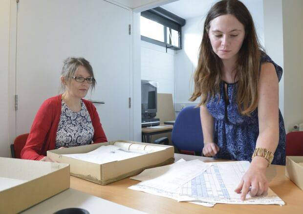Carryl Church, Archive Cataloguer, and Rebekah Taylor, Archivist, at work in the archives