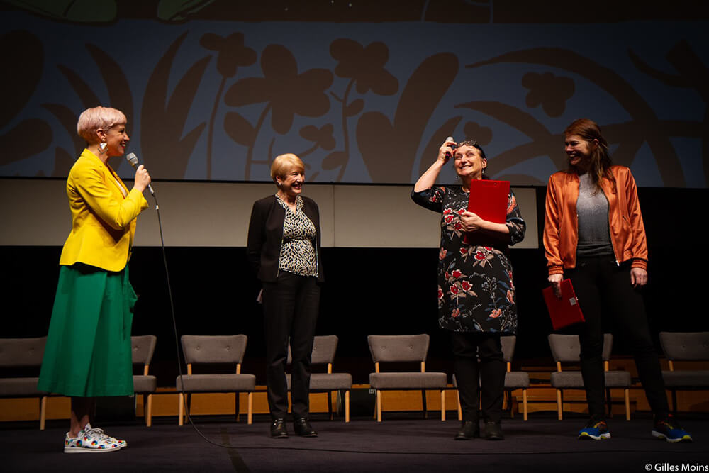 Doris Cleven (2nd left) hands over reins to Karin Vandenrydt (3rd left) and Dominique Seutin (right)